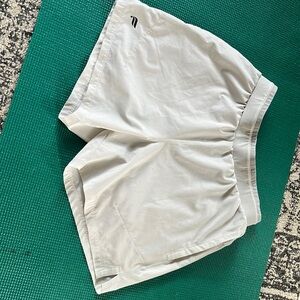 Men’s fabletics sport shorts. Grayish white color. Pockets and lining.